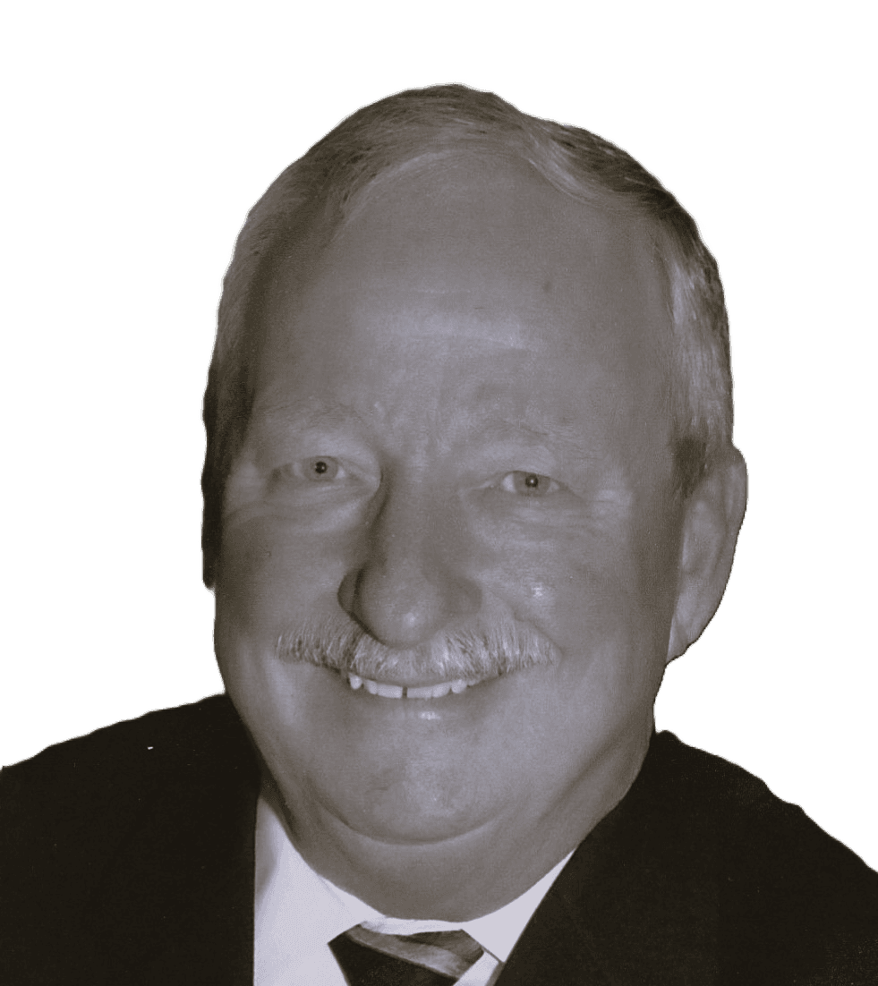 Person wearing a suit and tie against a black background.